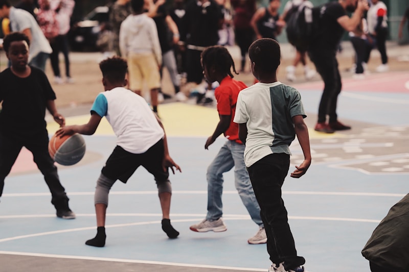 Students playing basketball on outdoor court
